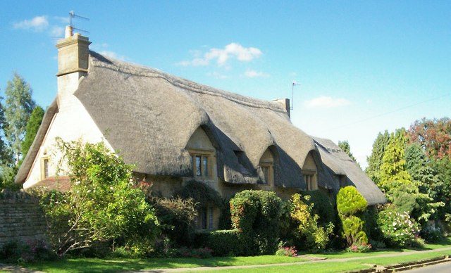 Honey stone thatched cottage frontage